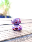 Set of 2 speckled beads in shades of violet & pinks