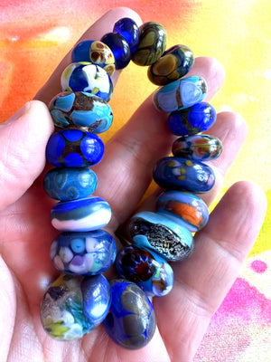 20 piece lampwork glass bead set in royal and indigo blues