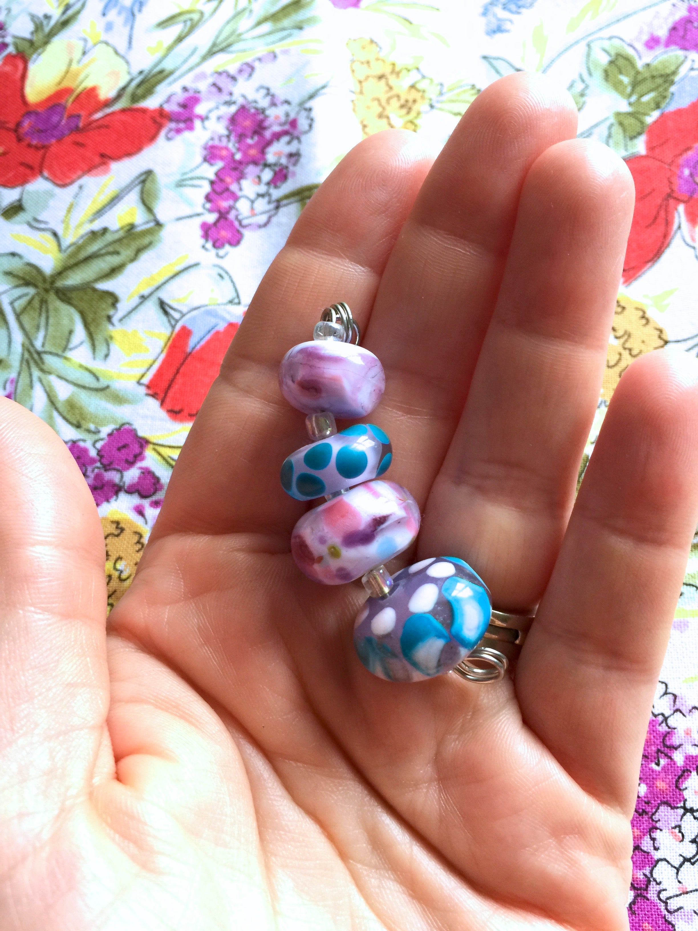 Set of 4 Handcrafted Lampwork Glass Beads in shades of Pink, Blues, Violet with spots and swirls.