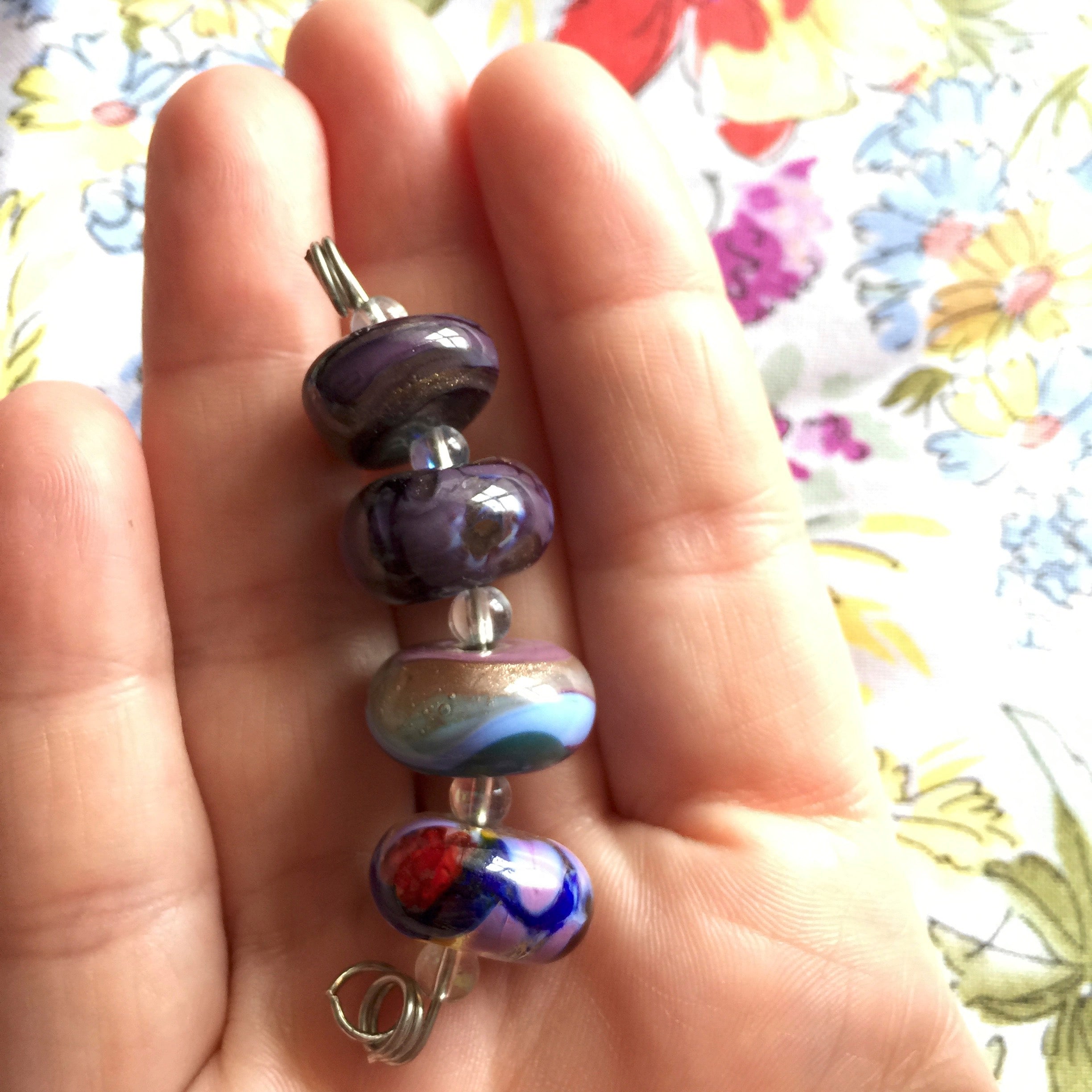 Set of 4 Funky and Unique Handcrafted Lampwork Glass Beads in purples and blues.