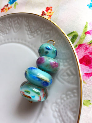 Set of 4 Handcrafted Lampwork Glass Beads in pretty light aqua