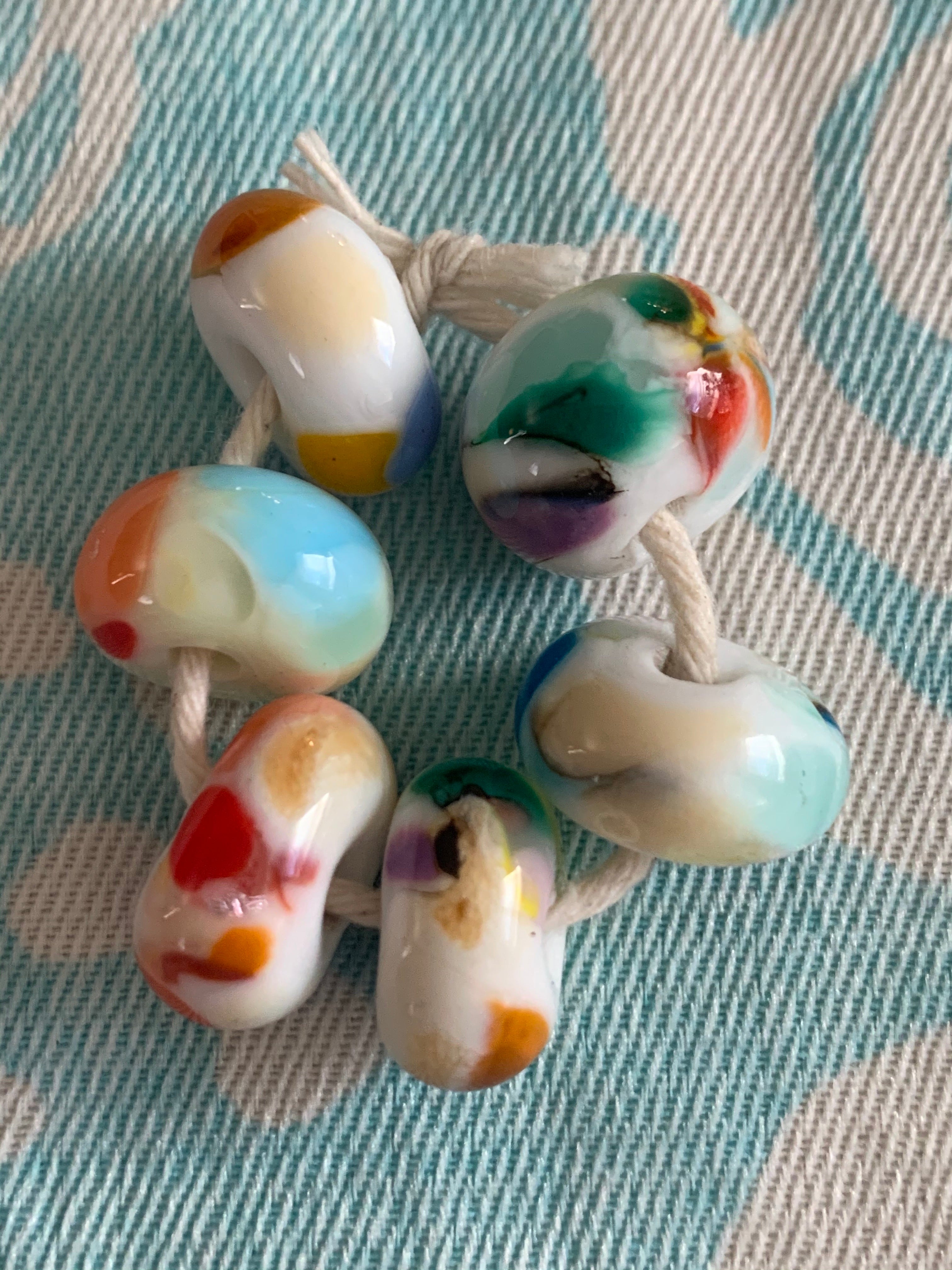 6 Handcrafted Glass Beads - white with bright colorful speckles.