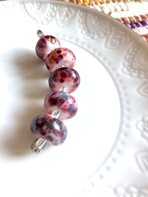 Set of 5 handcrafted light pink lampwork glass beads with beautiful speckles.