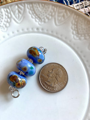 Set of 3 stunning periwinkle lampwork glass beads with multicolor speckling
