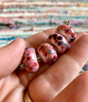 Set of 4 Handcrafted Lampwork Glass Beads in pink with pretty purple, red, coral speckles.
