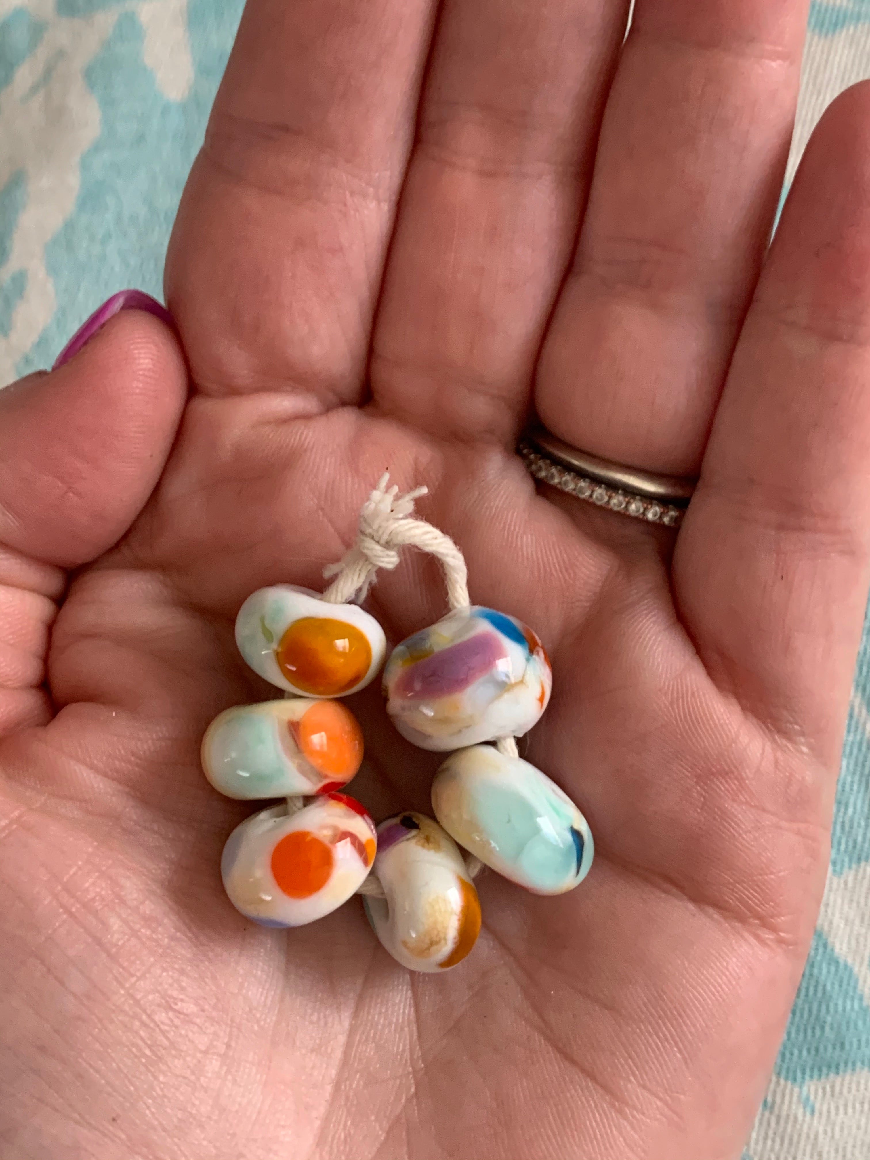6 Handcrafted Glass Beads - white with bright colorful speckles.
